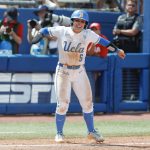 
              UCLA's Savannah Pola (5) celebrates after scoring a run during the fourth inning of an NCAA softball Women's College World Series game against Florida on Sunday, June 5, 2022, in Oklahoma City. (AP Photo/Alonzo Adams)
            