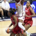 
              Atlanta Dream guard Aari McDonald (2) is fouled by Connecticut Sun guard Nia Clouden (11) during a WNBA basketball game Wednesday, June 15, 2022, in Uncasville, Conn. (Sarah Gordon/The Day via AP)
            