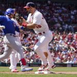 
              Chicago Cubs' Ian Happ, left, is forced out at first by St. Louis Cardinals first baseman Paul Goldschmidt during the seventh inning of a baseball game Sunday, June 26, 2022, in St. Louis. (AP Photo/Jeff Roberson)
            