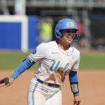 
              UCLA's Savannah Pola (5) celebrates after a hit to bring in three runs to win the game against Florida during an NCAA softball Women's College World Series game on Sunday, June 5, 2022, in Oklahoma City. (AP Photo/Alonzo Adams)
            