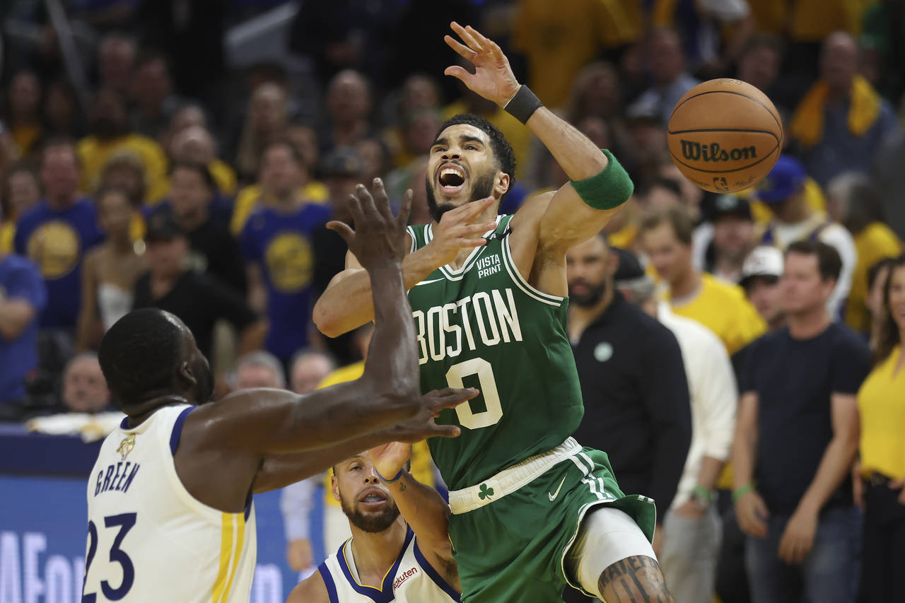 CORRECTS FROM GAME 1 TO GAME 2 - Boston Celtics forward Jayson Tatum (0) loses the ball while being...