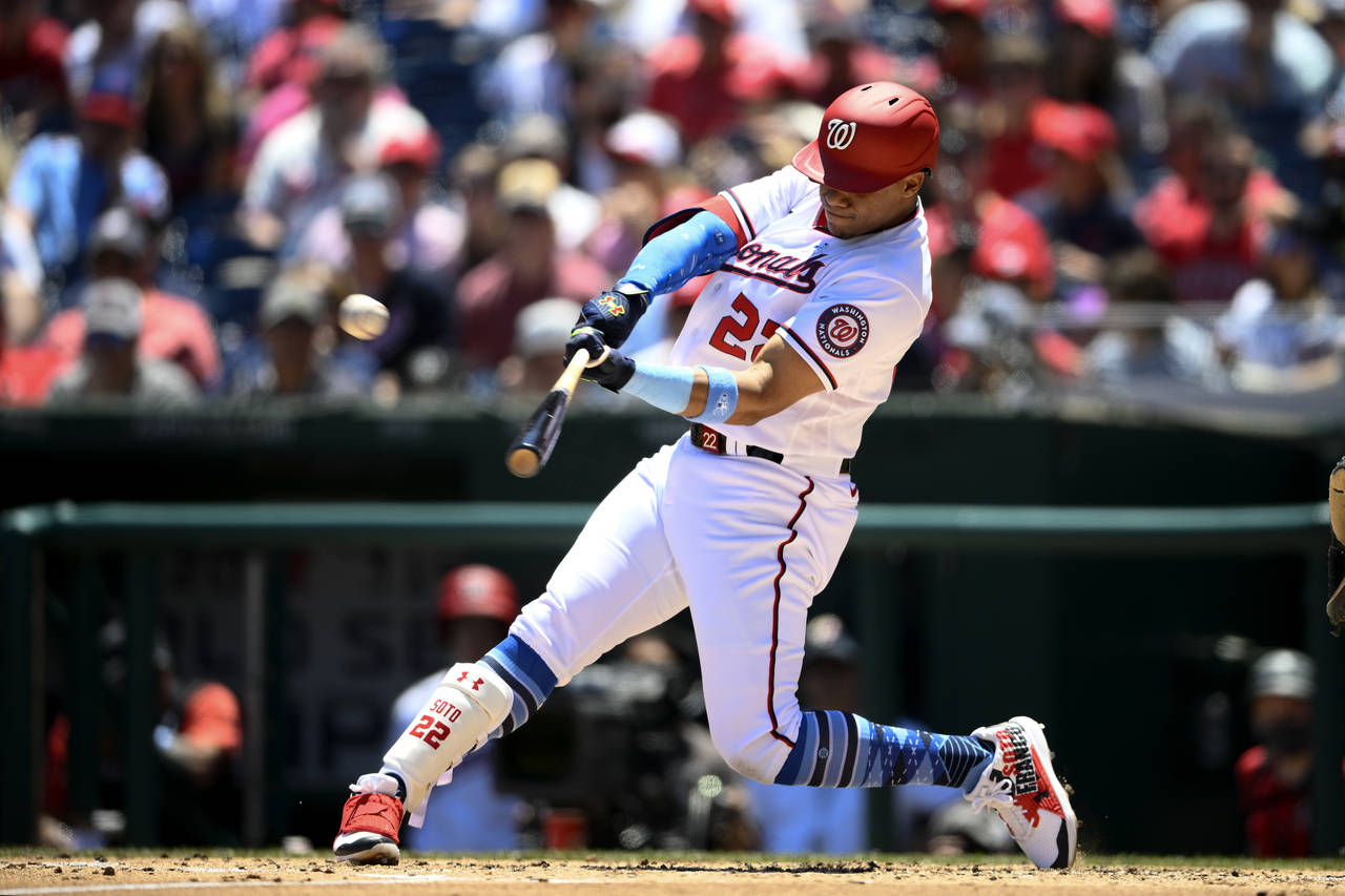 Washington Nationals' Juan Soto hits a three-run home run during the second inning of a baseball ga...