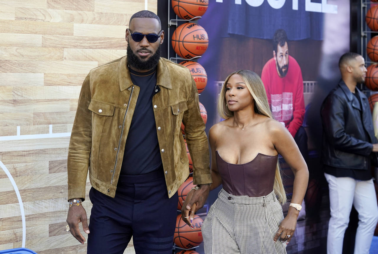 NBA basketball player LeBron James, a producer of the Netflix film "Hustle," and his wife Savannah ...