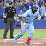 
              Toronto Blue Jays' Vladimir Guerrero Jr (27) spikes his bat after hitting a solo home run against the Minnesota Twins during the third inning of a baseball game Friday, June 3, 2022, in Toronto. (Jon Blacker/The Canadian Press via AP)
            