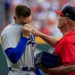 
              Los Angeles Dodgers first baseman Freddie Freeman, left, reacts as he is presented his World Series championship ring by Atlanta Braves manager Brian Snitker before a baseball game Friday, June 24, 2022m in Atlanta. (AP Photo/Butch Dill)
            