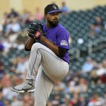 
              Colorado Rockies pitcher German Marquez winds up during the first inning of the team's baseball game against the Minnesota Twins, Friday, June 24, 2022, in Minneapolis. The (AP Photo/Craig Lassig)
            