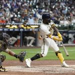 
              Milwaukee Brewers' Andrew McCutchen hits an RBI on a fielders choice during the fifth inning of a baseball game against the San Diego Padres Thursday, June 2, 2022, in Milwaukee. (AP Photo/Morry Gash)
            