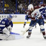 
              Tampa Bay Lightning goaltender Andrei Vasilevskiy (88) stops a shot by Colorado Avalanche left wing J.T. Compher (37) during the second period of Game 6 of the NHL hockey Stanley Cup Finals on Sunday, June 26, 2022, in Tampa, Fla. (AP Photo/Phelan Ebenhack)
            