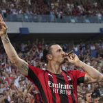 
              AC Milan's Zlatan Ibrahimovic puffs a cigar as he celebrates after winning a Serie A soccer match between AC Milan and Sassuolo, in Reggio Emilia's Mapei Stadium, Italy, Sunday, May 22, 2022. AC Milan secured its first Serie A title in 11 years on Sunday with a 3-0 win at Sassuolo. (Spada/LaPresse via AP)
            