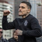 
              Australian boxer George Kambosos gestures during a public training session at Federation Square in Melbourne, Australia, Thursday, June 2, 2022. U.S.-based Australian boxer Kambosos will put his WBA, IBF and WBO belts on the line on Sunday at Melbourne's Marvel Stadium to fight American Devin Haney. (Diego Fedele/AAP Image via AP)
            