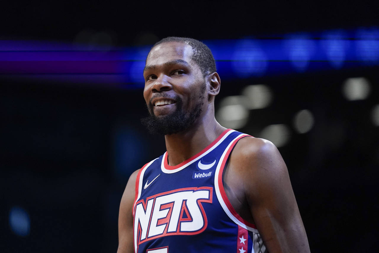 FILE - Brooklyn Nets' Kevin Durant is shown during the first half of an NBA basketball game against...