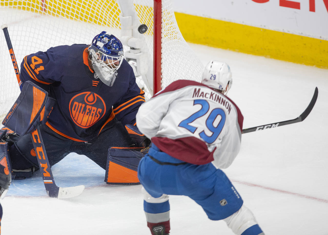 Colorado Avalanche's Nathan MacKinnon (29) scores on Edmonton Oilers goalie Mike Smith (41) during ...