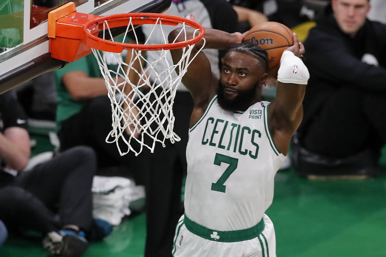 Boston Celtics guard Jaylen Brown (7) dunks the ball against the Golden State Warriors during the s...