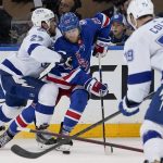 
              Tampa Bay Lightning defenseman Ryan McDonagh (27) checks New York Rangers defenseman Adam Fox (23) in the second period of Game 2 of the NHL hockey Stanley Cup playoffs Eastern Conference finals, Friday, June 3, 2022, in New York. (AP Photo/John Minchillo)
            