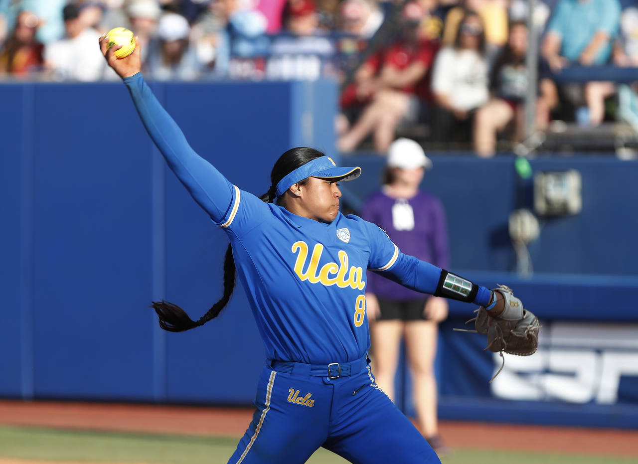 UCLA's Megan Faraimo pitches during the third inning of the team's NCAA softball Women's College Wo...