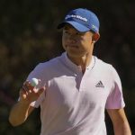 
              FILE - Collin Morikawa holds up his ball after an eagle putt on the 13th hole during the final round at the Masters golf tournament on Sunday, April 10, 2022, in Augusta, Ga. Morikawa is expected to compete in the U.S. Open in Brookline, Mass., to be played June 16-19. (AP Photo/Charlie Riedel, File)
            
