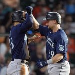 
              Seattle Mariners' Cal Raleigh (29) celebrates with Abraham Toro after both scored on Raleigh's home run against the Houston Astros during the fourth inning of a baseball game Wednesday, June 8, 2022, in Houston. (AP Photo/David J. Phillip)
            