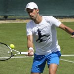 
              Serbia's Novak Djokovic plays a return as he practices ahead of the Wimbledon tennis championships in London, Sunday, June 26, 2022. (AP Photo/Alastair Grant)
            