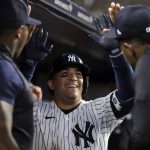 
              New York Yankees' Jose Trevino celebrates with teammates after hitting a home run during the fifth inning of a baseball game against the Chicago Cubs, Saturday, June 11, 2022, in New York. (AP Photo/Adam Hunger)
            