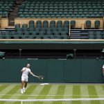 
              Spain's Rafael Nadal practices against Italy's Matteo Berrettini on Center Court ahead of the 2022 Wimbledon Championship at the All England Lawn Tennis and Croquet Club, in London, Thursday, June 23, 2022. (Steven Paston/PA via AP)
            
