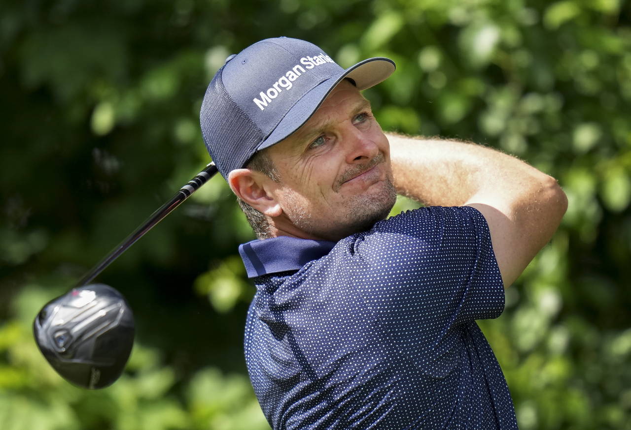 Justin Rose hits his tee shot the 14th hole during round one of the Canadian Open at St. George's G...