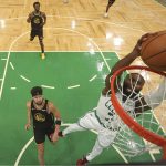 
              Boston Celtics guard Jaylen Brown (7) dunks the ball against Golden State Warriors guard Klay Thompson (11) in Game 3 of basketball's NBA Finals, Wednesday, June 8, 2022, in Boston. (Kyle Terada/Pool Photo via AP)
            