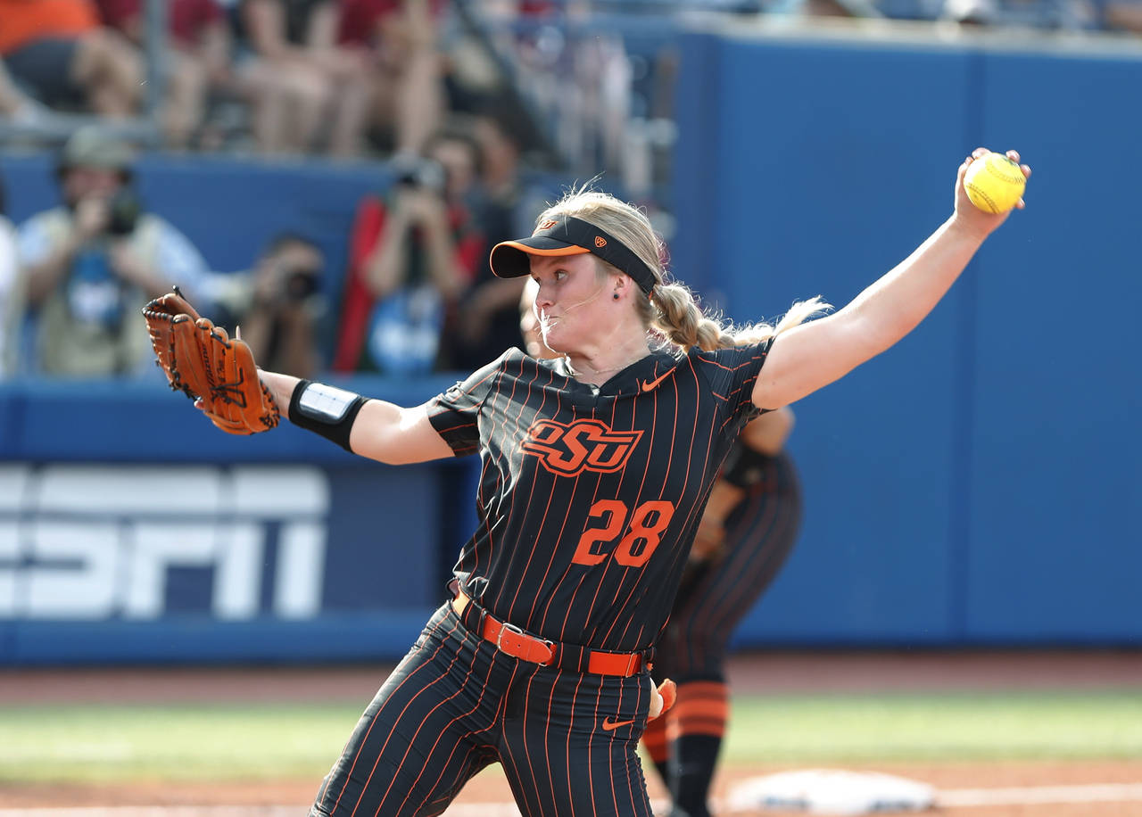 Oklahoma State's Kelly Maxwell pitches in the second inning of the team's NCAA softball Women's Col...