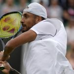 
              Australia's Nick Kyrgios returns to Serbia's Filip Krajinovic, in a second round men's single match on day four of the Wimbledon tennis championships in London, Thursday, June 30, 2022. (AP Photo/Alastair Grant)
            