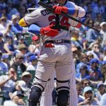 
              Chicago Cubs' Willson Contreras, right, hugs his brother Atlanta Braves catcher William Contreras during the first inning of a baseball game in Chicago, Saturday, June 18, 2022. (AP Photo/Nam Y. Huh)
            