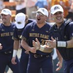 
              Notre Dame catcher David LaManna, right, celebrates with teammates after defeating Tennessee in an NCAA college baseball super regional game Sunday, June 12, 2022, in Knoxville, Tenn. (AP Photo/Randy Sartin)
            