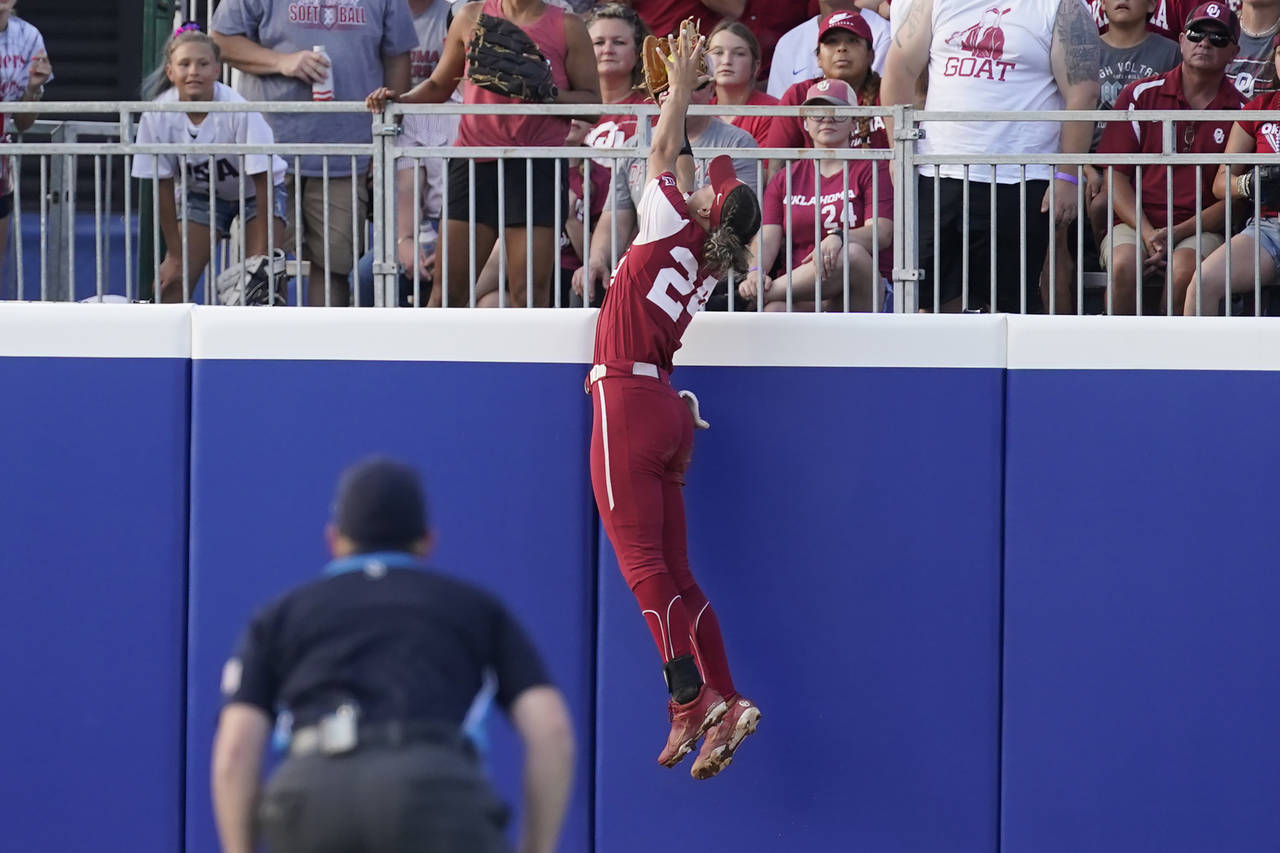 Oklahoma's Jayda Coleman catches a fly ball hit by Texas' Mary Iakopo during the first inning of th...