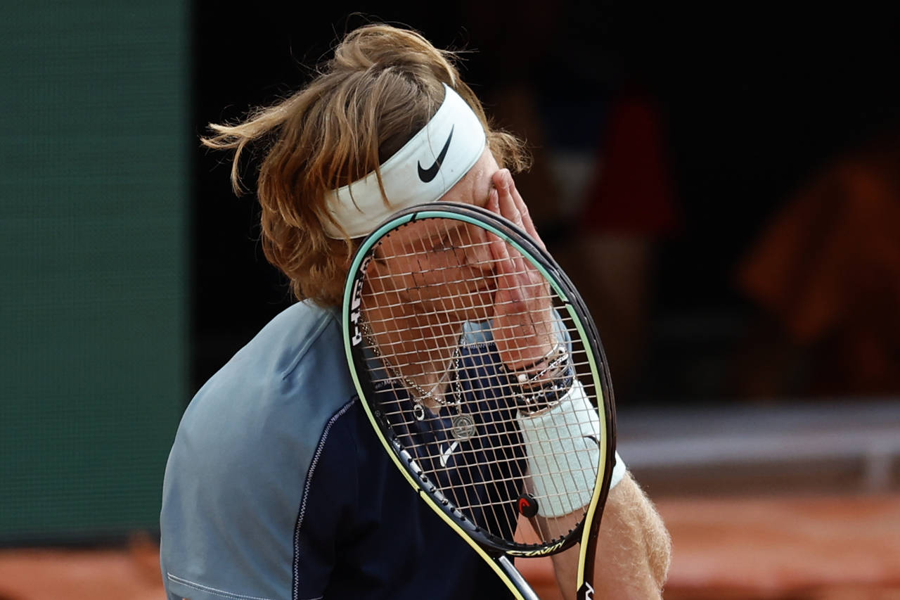 Russia's Andrey Rublev reacts after missing a shot against Croatia's Marin Cilic during their quart...