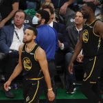 
              Golden State Warriors guard Stephen Curry (30) and forward Draymond Green (23) react during the third quarter of Game 3 of basketball's NBA Finals against the Boston Celtics, Wednesday, June 8, 2022, in Boston. (AP Photo/Michael Dwyer)
            