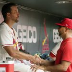 
              St. Louis Cardinals starting pitcher Adam Wainwright, left, gets a handshake from Cardinals manager Oliver Marmol after working the seventh inning of a baseball game against the Cincinnati Reds Saturday, June 11, 2022, in St. Louis. (AP Photo/Jeff Roberson)
            