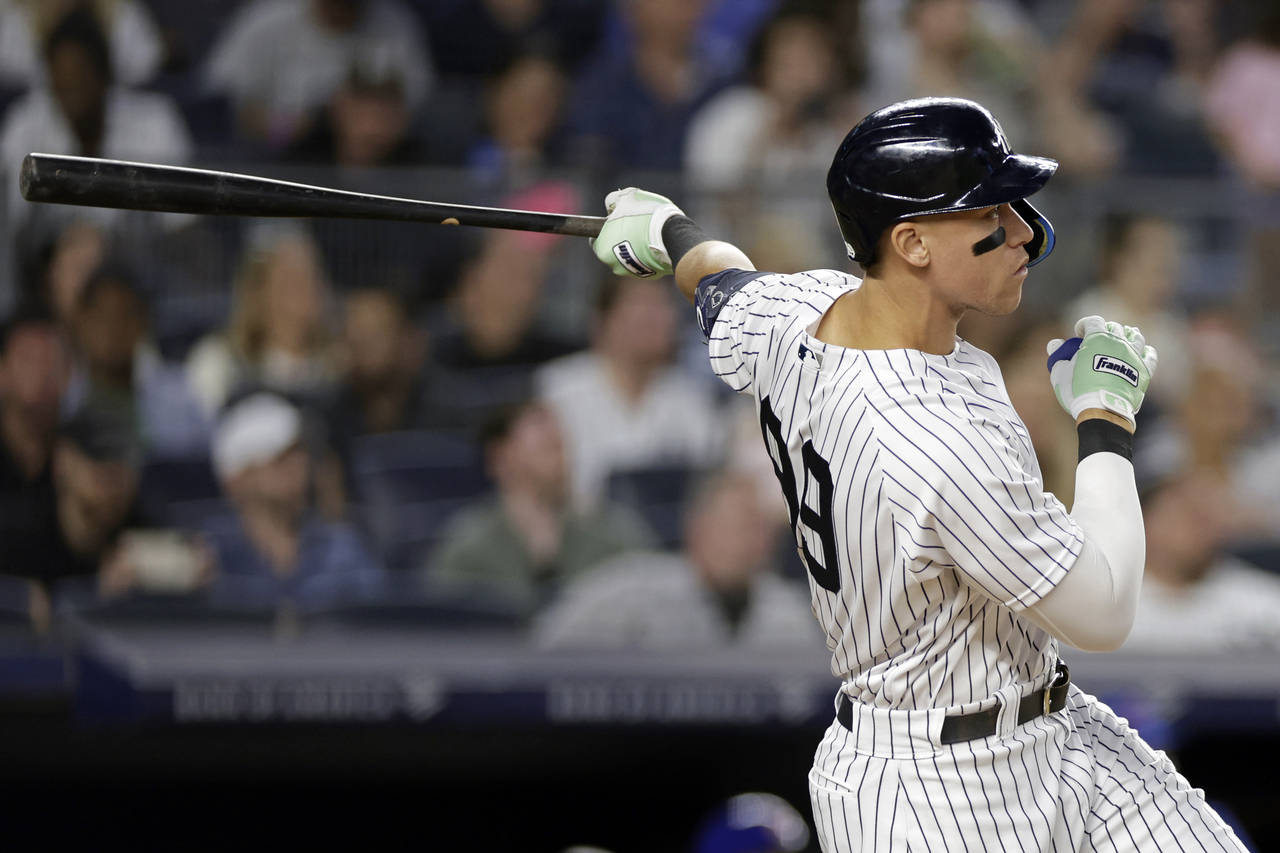 New York Yankees designated hitter Aaron Judge watches his home run during the fifth inning of a ba...
