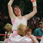 
              FILE - Three-time world champion Christy Martin, of Orlando, Fla., celebrates her victory over Deirdre Gogarty as her husband and trainer Jim Martin holds her up at the MGM Grand Garden in Las Vegas, March 16, 1996. Christy Martin will be inducted into the Boxing Hall of Fame in Canastota, N.Y., on Sunday, June 12, 2022. (AP Photo/Lennox McLendon, File)
            