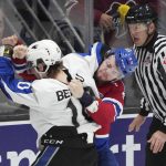 
              Edmonton Oil Kings' Jaxsen Wiebe, right, and Saint John Sea Dogs' Riley Bezeau fight during the first period of a Memorial Cup hockey game Wednesday, June 22, 2022, in Saint John, New Brunswick. (Darren Calabrese/The Canadian Press via AP)
            