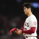 
              Los Angeles Angels' Shohei Ohtani (17) stands on third base during the fifth inning of a baseball game in Anaheim, Calif., Wednesday, June 22, 2022. (AP Photo/Ashley Landis)
            