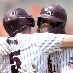 
              Missouri State's Grant Wood, right, hugs teammate Will Duff (5) after a home run against Oklahoma State during an NCAA college baseball tournament regional game Sunday, June 5, 2022, in Stillwater, Okla. (Ian Maule/Tulsa World via AP)
            