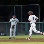 
              Stanford's Brock Jones (7) runs the bases in front of Connecticut third baseman Zach Bushling (8) after hitting a two-run home run during the second inning of an NCAA college baseball tournament super regional game Saturday, June 11, 2022, in Stanford, Calif. (AP Photo/John Hefti)
            