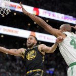 
              Golden State Warriors guard Stephen Curry (30) goes up for a shot against Boston Celtics center Al Horford (42) during the fourth quarter of Game 4 of basketball's NBA Finals, Friday, June 10, 2022, in Boston. (AP Photo/Steven Senne)
            