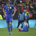 
              Ukraine's Vitaliy Mykolenko, left, and Ukraine's Mykhailo Mudryk seen in dejection at the end of the World Cup 2022 qualifying play-off soccer match between Wales and Ukraine at Cardiff City Stadium, in Cardiff, Wales, Sunday, June 5, 2022. Wales won 1-0. (AP Photo/Rui Vieira)
            