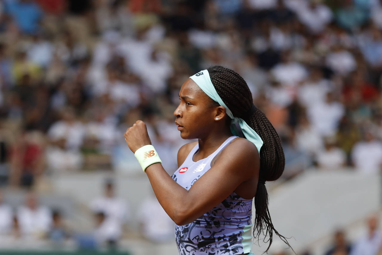 Coco Gauff of the U.S.celebrates scoring a point as she plays Italy's Martina Trevisan during their...