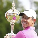 
              Rory McIlroy, of Northern Ireland, looks back to media as he holds the trophy after winning the final round of the Canadian Open golf tournament at St. George's Golf and Country Club in Toronto,  Sunday, June 12, 2022. (Nathan Denette/The Canadian Press via AP)
            