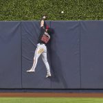 
              Washington Nationals left fielder Lane Thomas (28) can't catch a home run hit by Miami Marlins' Jazz Chisholm Jr. in the second inning of a baseball game, Tuesday, June 7, 2022, in Miami. (AP Photo/Marta Lavandier)
            