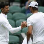 
              Spain's Rafael Nadal, right, greets Serbia's Novak Djokovic during a practice session on on Center Court ahead of the 2022 Wimbledon Championship at the All England Lawn Tennis and Croquet Club, in London, Thursday, June 23, 2022. (Steven Paston/PA via AP)
            