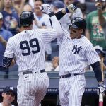 
              New York Yankees' Aaron Judge (99) celebrates with Anthony Rizzo (48) after hitting a solo home run off Detroit Tigers starting pitcher Beau Brieske (63) in the first inning of a baseball game, Saturday, June 4, 2022, in New York. (AP Photo/John Minchillo)
            