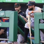 
              San Francisco Giants manager Gabe Kapler, left, stands in the dugout next to Brandon Belt during the first inning of the team's baseball game against the Pittsburgh Pirates in Pittsburgh, Friday, June 17, 2022. (AP Photo/Gene J. Puskar)
            