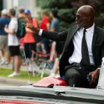 
              International Boxing Hall of Fame class of 2022 inductee Bernard Hopkins waves to paradegoers during the annual Parade of Champions on Sunday, June 12, 2022, in Canastota, N.Y. (John Haeger/Standard-Speaker via AP)
            