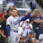 
              Former Atlanta Braves player Freddie Freeman tips his helmet to fans as he takes the plate to bat in the first inning, returning to Atlanta with the Los Angles Dodgers for a baseball game on Friday, June 24, 2022, in Atlanta. (Curtis Compton/Atlanta Journal-Constitution via AP)
            